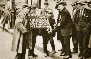 Street hawkers sell football favours, Kings Cross